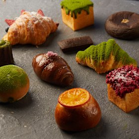 Japanese baked goods including melon pan, manju, and shio-pan.