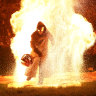 Dark rituals: the hooded-man emerges from the flames at Puca.