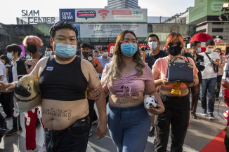 Protest leaders Parit Chiwarak and Panusaya Sitthijirawattanakul at a protest in Bangkok last December.