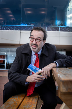 Martin Pakula watches his winning bet salute in a photo finish at Caulfield.