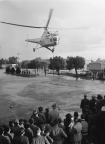 A helicopter laden with emergency supplies lands in Forbes on June 20, 1952
