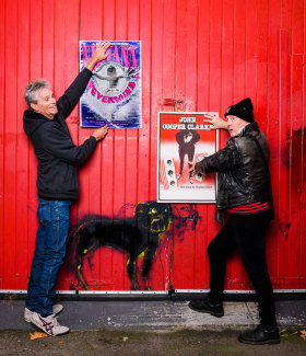 John Foy (right) and fellow poster artist Ben Brown with their original works.