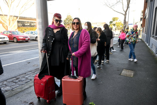 Lucy Dalston (left) and Sacha Wendt from South Australia came straight from the airport to queue at Beatrix Bakes in North Melbourne.