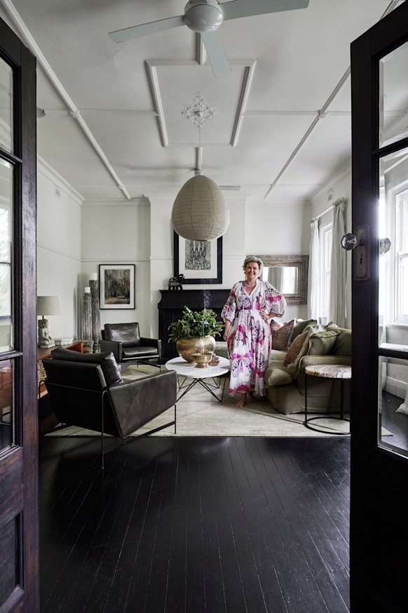 Kelly McCloskey in her upstairs lounge. The sofa is by Maker & Son;  the artwork is by Bronwyn Bancroft.