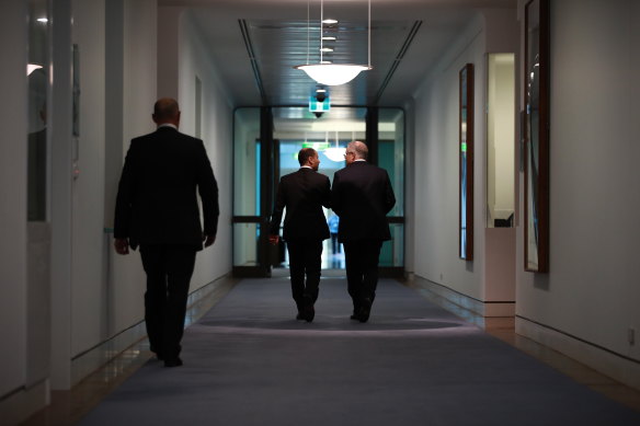 Prime Minister Scott Morrison and deputy leader Josh Frydenberg leaving a leadership spill on Friday.
