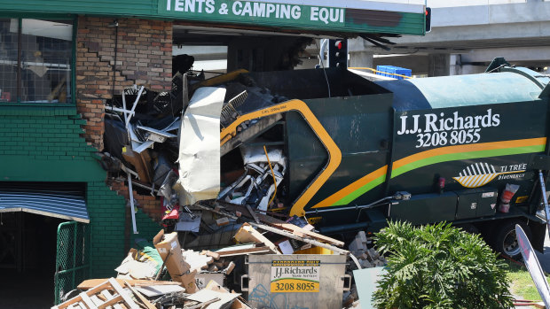 The scene of an accident in which a garbage truck has ploughed into a Tentworld camping shop in Brisbane.