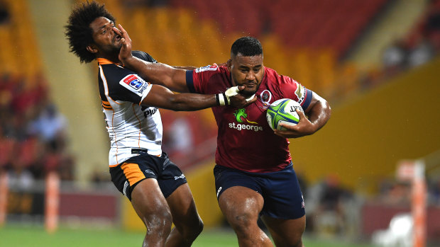 Taniela Tupou of the Reds (right) pushes Henry Speight of the Brumbies during the Round 3 Super Rugby match between the Queensland Reds and the Brumbies at Suncorp Stadium.