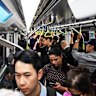 Commuters pack a CBD-bound metro train during the morning peak.