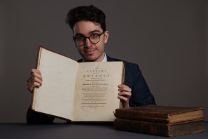 Mark Wiltshire, a book specialist at Christie’s, with Matthew Flinders’ copy of James Cook’s account of his voyage to Australia.
