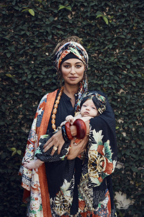 Camilla “Geisha Girl” kimono coat, $599, “Queen of Kings” kimono blouse, $549, and “Queen of Hearts” headband, $79. Dinosaur Designs “Boulder” bangle, $105. Elsa Peretti for Tiffany & Co. bangles, $670 each. Other jewellery, her own.