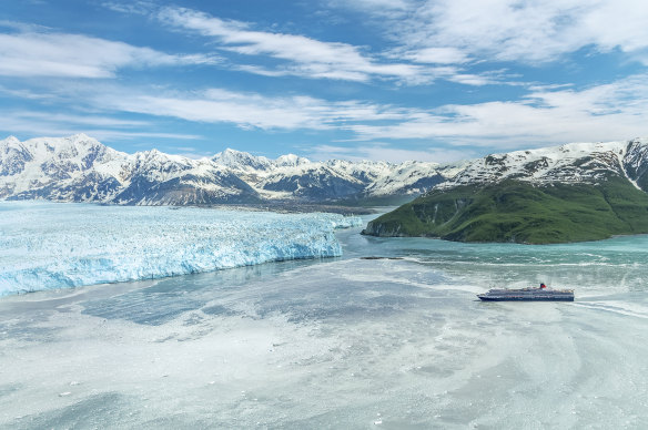 The Queen Elizabeth, dwarfed by ice in Glacier Bay, Alaska.