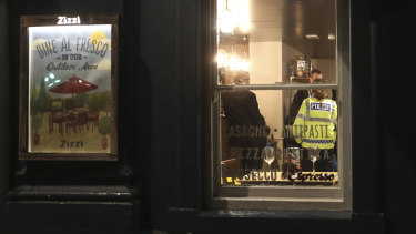 Police inside a restaurant in Salisbury that was closed in connection with the incident.