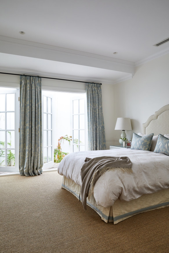“I think a master bedroom should always be a calm and serene place,” says Monique.  The curtain and bed cushion fabric are by Lewis and Wood, from Elliott Clarke, 