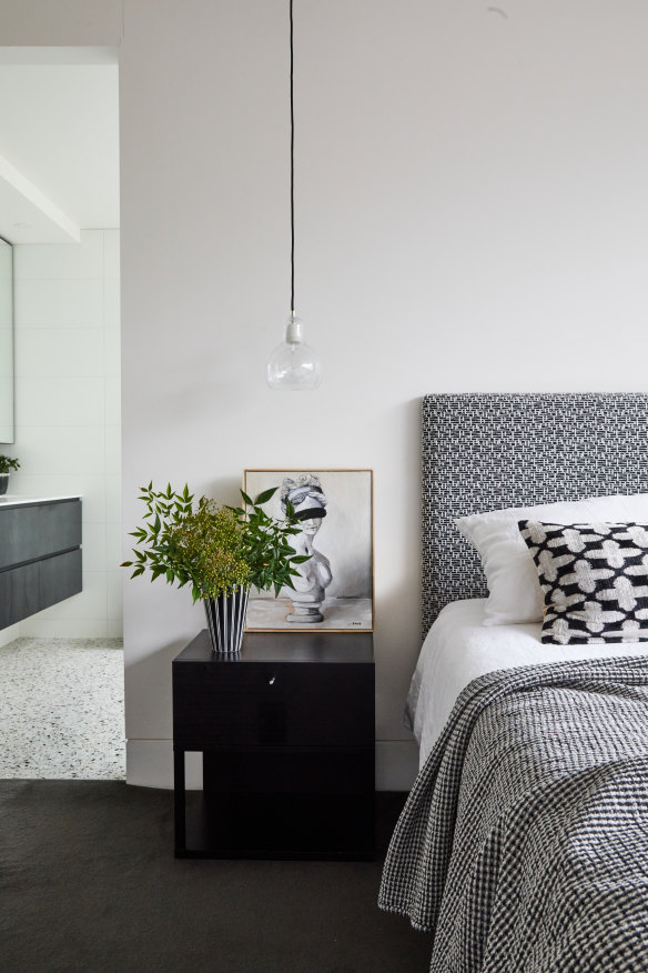 The spacious main bathroom is directly off the bedroom. Terrazzo tiles are from Tiento Tiles. Artwork is by Tane Ozlu.