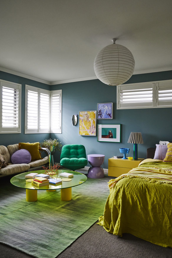 “This is my calmer colour scheme: muted blue walls with stronger colour on décor and furniture,” says Banfield. The Grazia & Co coffee table sits on a Loom rug.
