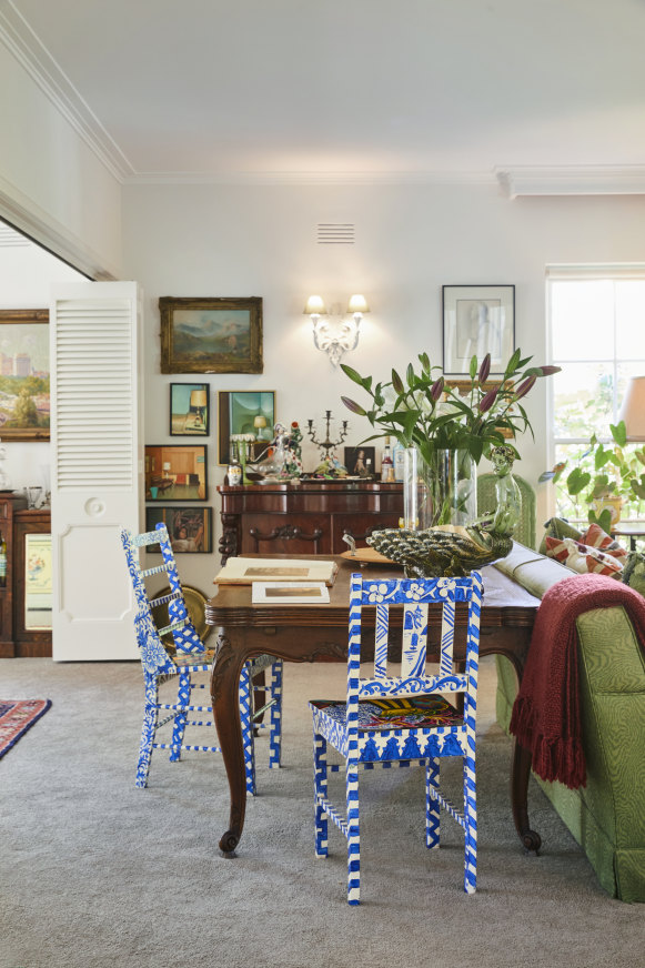 Two hand-painted chairs by Melbourne artist Greg Irvine feature in the large lounge room, which can be divided by concertina doors.