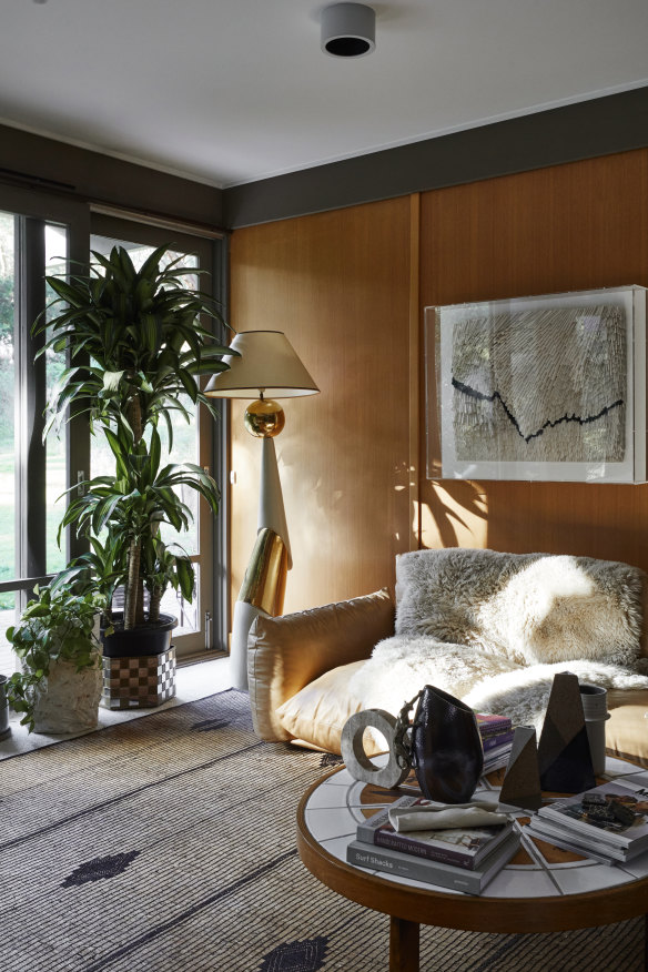 “The living spaces all face north, and I love how the light dances on the floor throughout the day,” says Haag. In the family 
lounge, a 1970s lamp by François Chatain was bought through 1st Dibs and the sofa, from Space, is by Arflex.