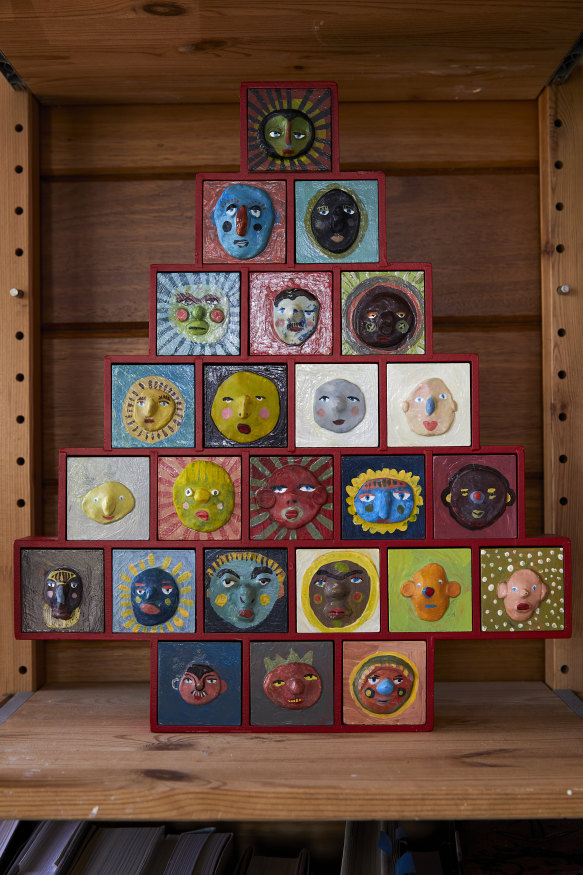 Christmas decor at Mestrom’s house in the mountains includes an Advent calendar handmade by the artist from wood and papier mâché. 