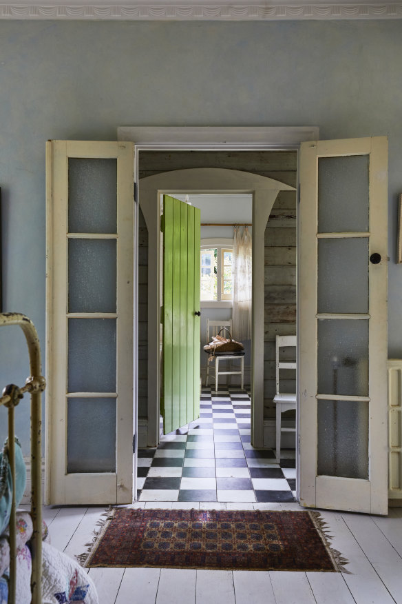 Reclaimed timber, tiles and French doors found on eBay feature in the bedroom and ensuite bathroom. “I like to listen to the space, or the object, and let them guide me,” says Pottage.