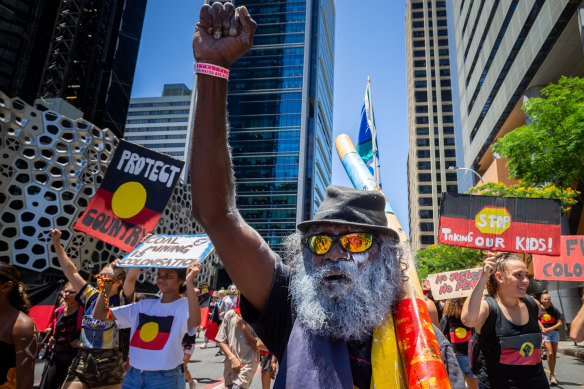 Invasion Day protesters march through the streets.