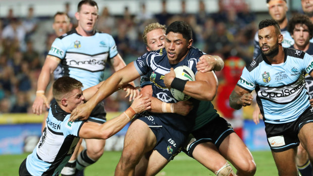 Hard to stop: Jason Taumalolo picks up where he left off last season with a barnstorming run against the Sharks.