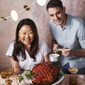 RecipeTin Eats’ Nagi Maehashi and Jean-Baptiste Alexandre with the maple-glazed ham.