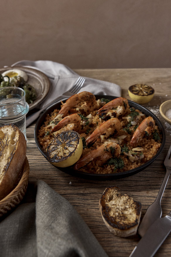 Prawn and scallop paella with green salsa.