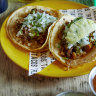 Chipotle barbacoa beef taco (left) and al pastor pork and pineapple taco at Ricos Tacos.