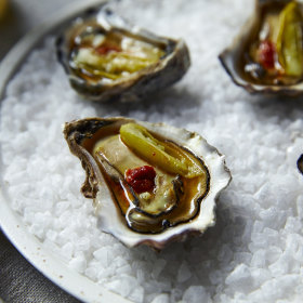 Beef fat-dripped flambadou oysters.
