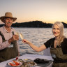 Sheridan Beaumont, right, and her father, Phil Barry-Cotter run tours at their oyster farm north of Sydney.