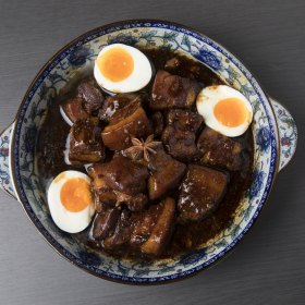 Soy-braised pork belly with eggs. 