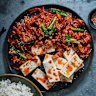 Stir-fried pork and kimchi with boiled tofu.