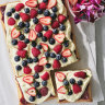 Helen Goh’s berry and custard traybake is perfect for midsummer picnics and barbecues