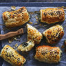 Kale and three-cheese pastries sprinkled with nigella seeds.