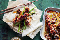 Char sui pork skewers with cucumber and sesame salad.