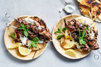Sticky orange and sumac lamb skewers with pickled cucumber tzatziki.