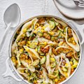 Pasta shells with zucchini and corn.