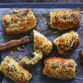 Kale and three-cheese pastries sprinkled with nigella seeds.