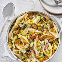 Pasta shells with zucchini and corn.