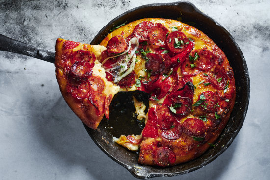 Using store-bought dough gives you a fast track to American-style pepperoni deep-dish pizza.