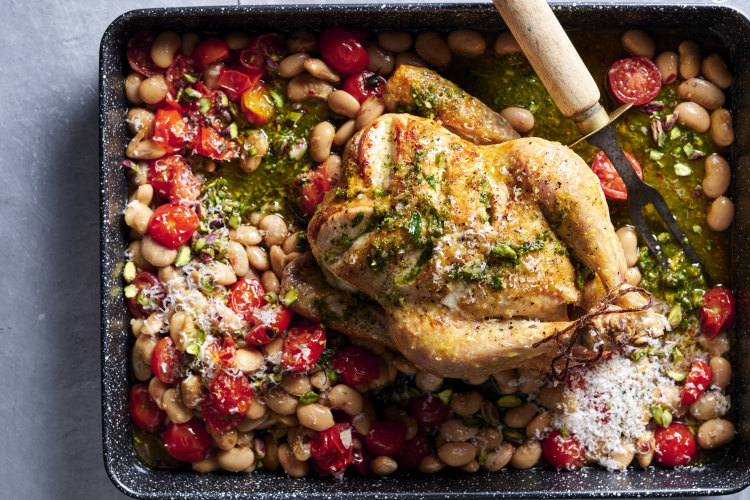 Tomato, bean and chicken tray bake with mint pesto.