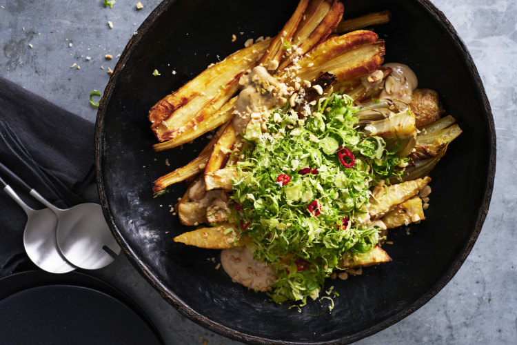 An autumn salad of roasted celeriac, parsnip and fennel with Brussels sprouts, chilli-maple dressing, tofu “mayo” and peanuts.