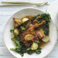 Braised duck with bacon, prunes and kale.