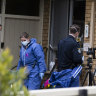 Police officers at the Marsfield home on Thursday.