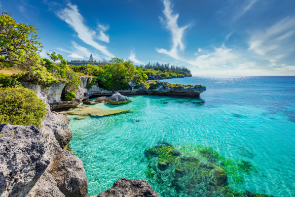 The turquoise lagoon at Tadine Bay, south-west coast of Maré Island, part of the Loyalty Islands, New Caledonia.