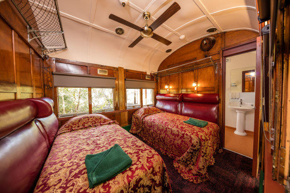 Restored railway carriages are set along an original teamsters’ coach road under shady trees.
