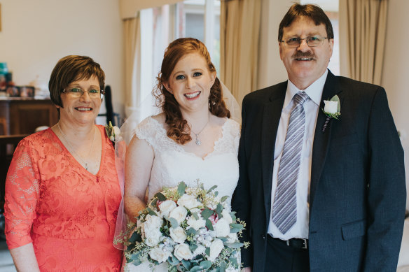 Hayley Smith with her parents, Murray and Jenny, on Hayley's wedding day.