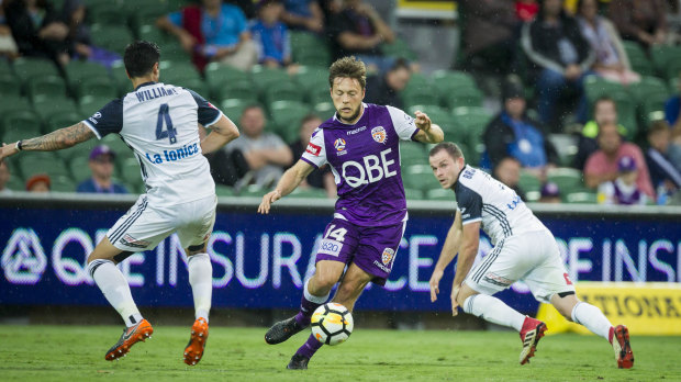 Good touch: Glory's Chris Harold finds space and swerves past Victory centre-half Rhys Williams.