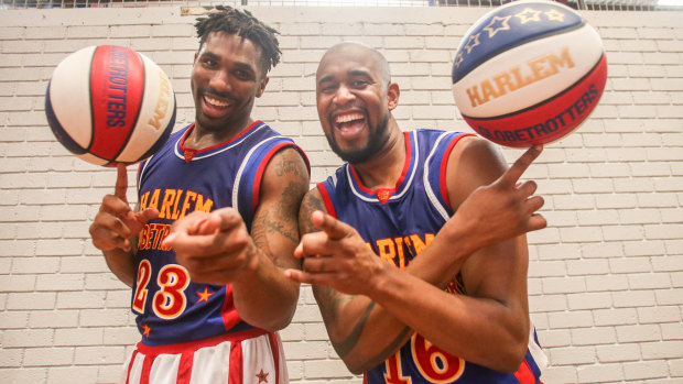 Harlem Globetrotters "Thunder'' (left) and "Scooter'' are a big wrap for Australia's Ben Simmons.