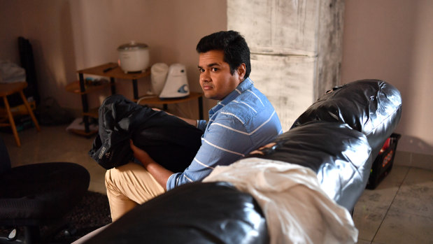 Mr Ponnamaneni was asleep on his couch when he was attacked by a trio of burglars. 